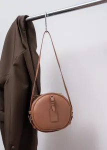 Vintage round leather crossbody bag, stylish brown top grain cowhide circle handbag.