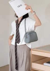 Genuine leather shoulder bag underarm style chic minimalist grey crossbody bag detail.