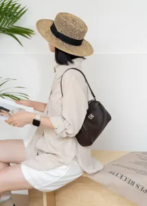 Genuine leather underarm shoulder bag with metal lock, chic retro style for women.
