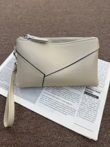 Minimalist genuine leather wristlet clutch bag for women, elegant beige daily purse and phone wallet.