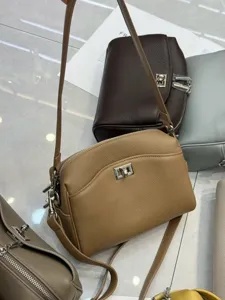 Genuine leather shoulder bag with turn-lock, casual underarm baguette bag for women.