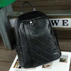 Close-up of black leather backpack detail, soft quilted texture, practical daily carry style.
