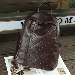 Detailed view of the dark brown genuine leather quilted backpack showcasing soft texture.
