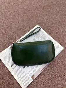 Dark green semi-circular genuine leather clutch bag waterproof cosmetic pouch with wrist strap.