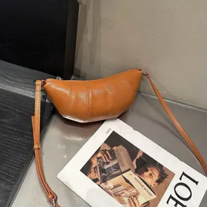 Minimalist genuine leather croissant bag, stylish brown dumpling crossbody bag for women.