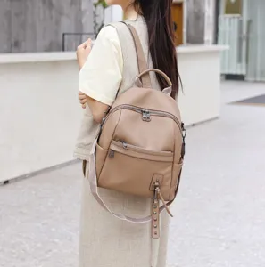 Genuine leather women's backpack, stylish taupe casual daypack and chic convertible shoulder bag.