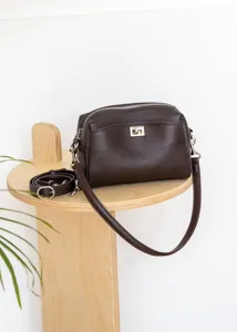 Dark brown genuine leather shoulder bag featuring metal turn-lock closure and strap.