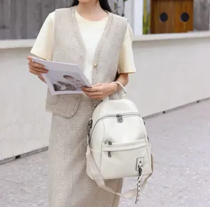 Stylish white leather backpack for women, genuine cowhide convertible shoulder and crossbody bag.