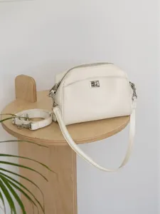 White leather shoulder bag minimalist crossbody handbag with metal lock and strap for women