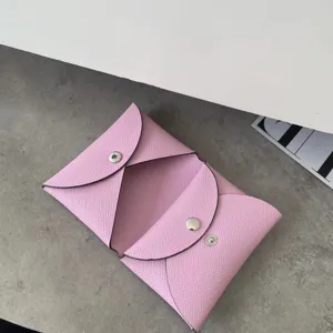 Pink genuine leather envelope coin purse and card holder with elegant snap button design.