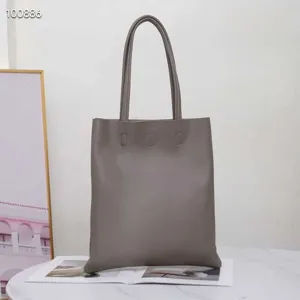 Minimalist grey leather tote bag, vertical large capacity single shoulder bag for daily use.
