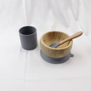 Baby bamboo bowl and silicone cup tableware set detail showing suction base and spoon handle.
