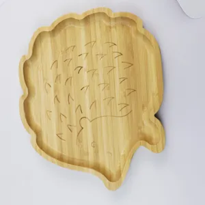 Detail view of a cute hedgehog shaped wooden tray, perfect for serving fruits and snacks.