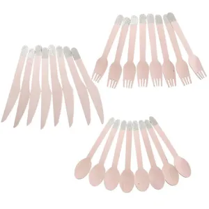 Wooden cutlery set detail showing pink birch wood forks, knives, and spoons with silver glitter.