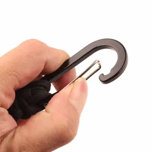 Close-up detail of outdoor paracord keychain metal carabiner clasp showing mechanism.
