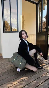 Retro dark green vintage style canvas leather shoulder bag, detailed view of retro metal buckles.