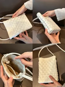 Detail view of white woven leather phone bag showing texture, side profile, and interior lining.