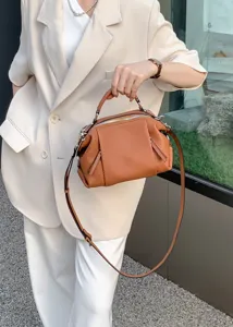 Premium genuine leather shoulder handbag with geometric panel design, stylish women crossbody bag.
