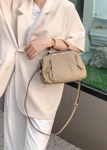 Stylish top-grain leather handbag for women, casual shoulder and crossbody design detail view.