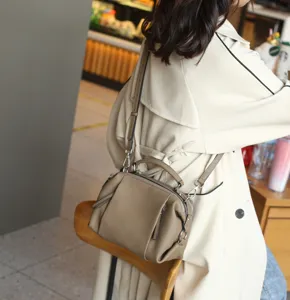 Detailed view of women genuine leather shoulder crossbody bag in grey-brown casual fashion style.