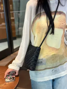 Woven leather phone bag black crossbody pouch stylish mini shoulder bag for women detail view