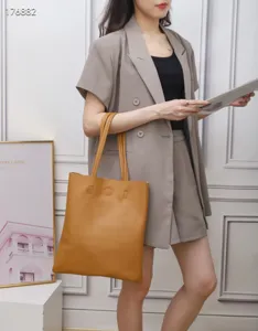 Brown leather tote bag for women, large capacity minimalist shoulder bag for daily commute.