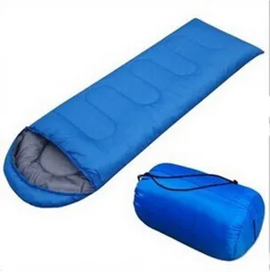 Blue hooded envelope sleeping bag with storage sack for outdoor camping and hiking travel.