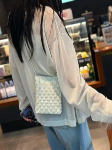 White woven leather crossbody phone bag, chic minimalist shoulder handbag for daily use.