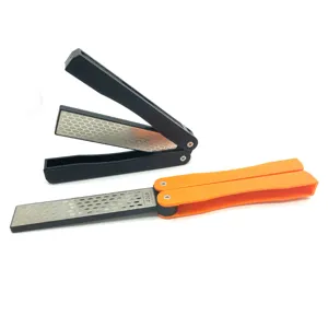 Portable folding diamond whetstone sharpener detail view showing textured handle and grit surface.