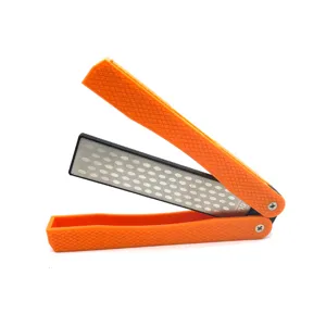 Portable folding diamond sharpening stone detail view, double sided sharpener with orange handle.