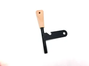 Wooden handle flint fire starter tool with multi-functional scraper for outdoor survival camping.