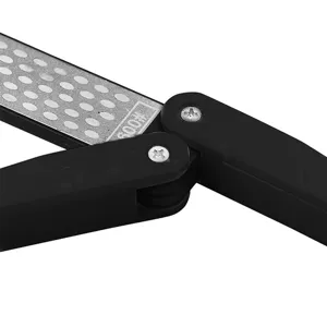 Portable folding knife sharpener with diamond whetstone and black handle for outdoor use.