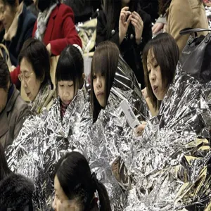 Silver emergency survival foil thermal blanket for outdoor camping, hiking and rescue use.