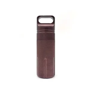 Close-up detail of a portable EDC aluminum alloy sealed storage canister for outdoor camping.