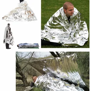 Emergency silver thermal blanket for outdoor survival, waterproof camping shelter and sun gear.