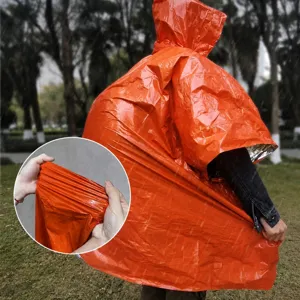 Outdoor emergency thermal poncho detail showing tear-resistant orange foil material for survival.