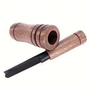 Wooden duck call outdoor hunting whistle tool detail view showing wood texture and reed.
