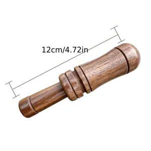 Detailed view of the wooden duck call, showing natural wood grain texture and precise 12cm size.