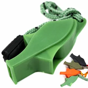 Close-up view of the green survival dolphin whistle with woven lanyard, durable plastic.