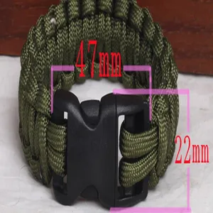 Outdoor survival parachute cord bracelet detail with plastic buckle and size marks.