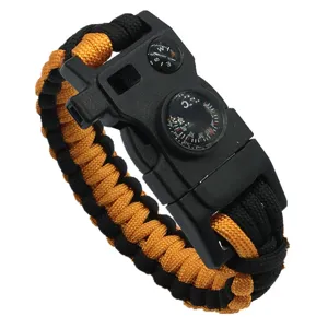 Bracelet de survie en paracorde d'extérieur avec boussole et sifflet, noir et orange tactique.