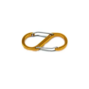 Close-up detail of a gold aluminum alloy S-shaped carabiner with dual spring wire gates.