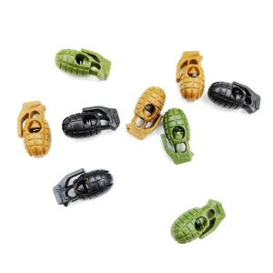 Vue détaillée de stoppeurs de cordon en plastique en forme de grenade colorée pour accessoires.