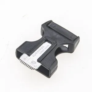 Black plastic tactical survival side release buckle with metal scraper detail close up view