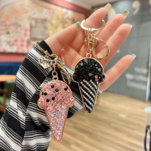 Detailed close-up of sparkling rhinestone ice cream keychain and bag pendant accessory.