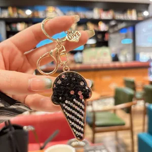 Detailed view of rhinestone ice cream keychain, sparkling crystal bag charm and accessory.
