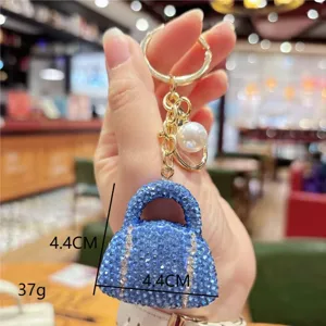 Blue rhinestone handbag keychain, sparkling mini purse keyring for car keys and bags.