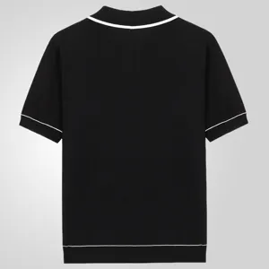 Black short-sleeve knit polo shirt detail, contrast white trim on collar, cuffs and hem.