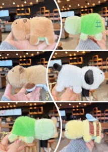 Detailed view of cute reversible capybara plush keychain, soft animal bag pendant.