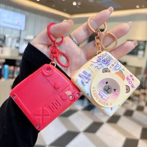 Lindo llavero de cámara capibara juguete, colgante de bolsa luminoso y accesorio creativo.